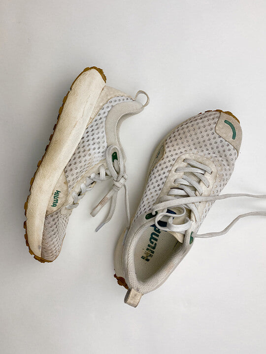 Well worn pair of white Hilma Running shoes