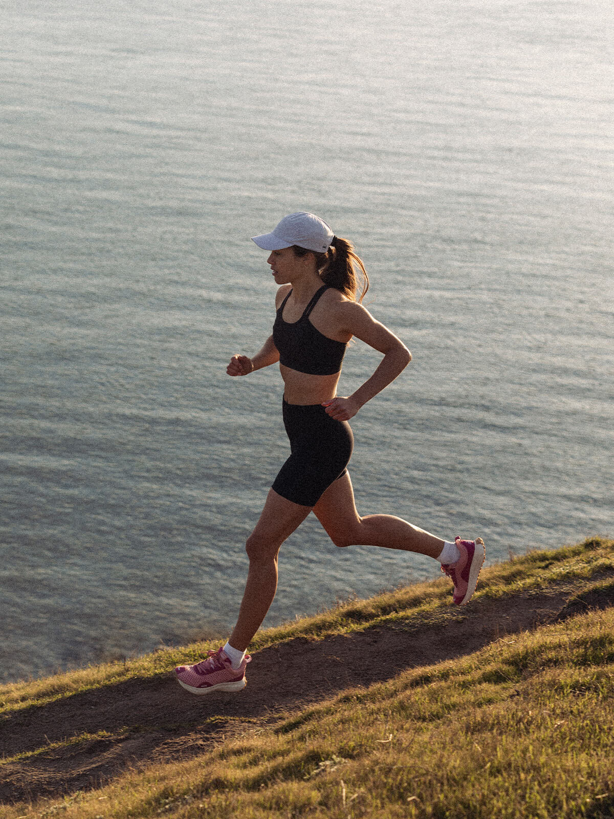 Woman Running in Pink Hilma Running Shoes
