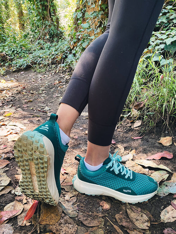 Evergreen Hilma running shoes in nature. Hilma Running Instagram Page.