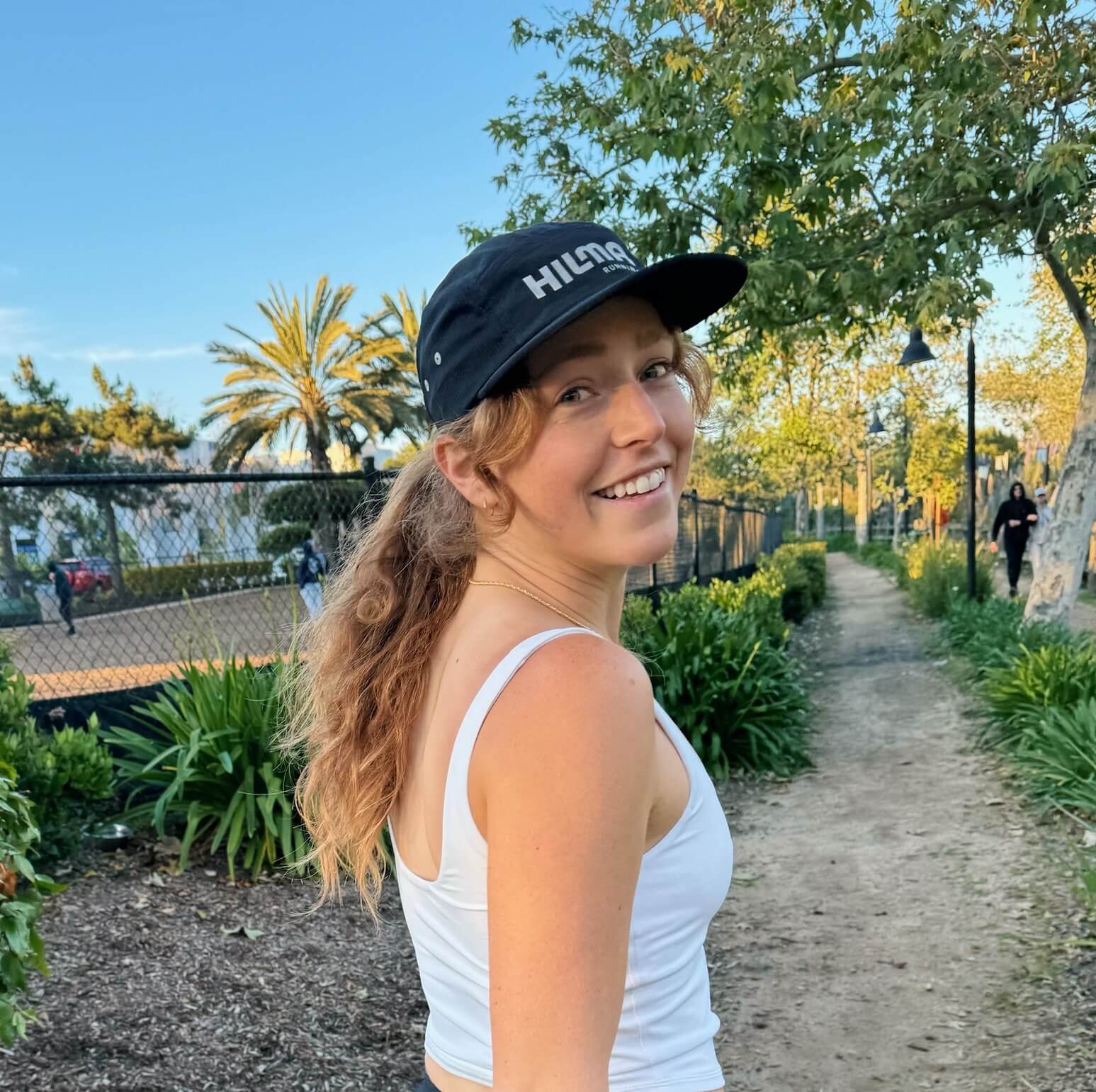 Woman wearing Hilma's Black Running Hat