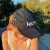 Woman wearing Hilma's Black Running Hat