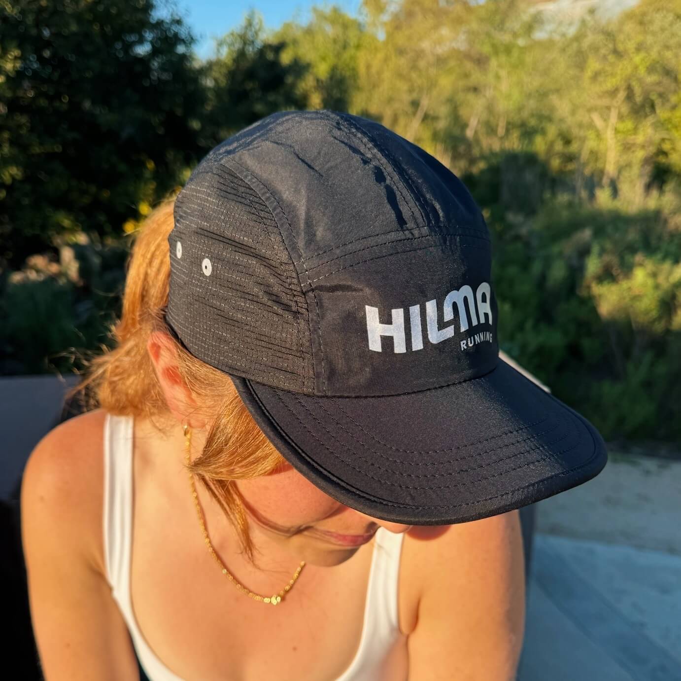 Woman wearing Hilma's Black Running Hat