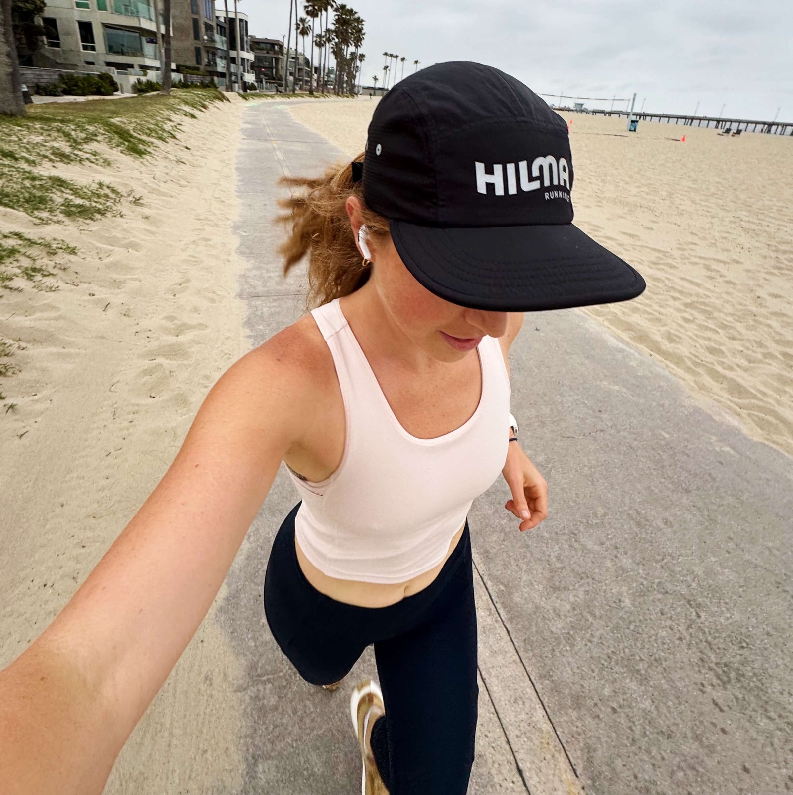 Woman wearing Hilma's Black Running Hat