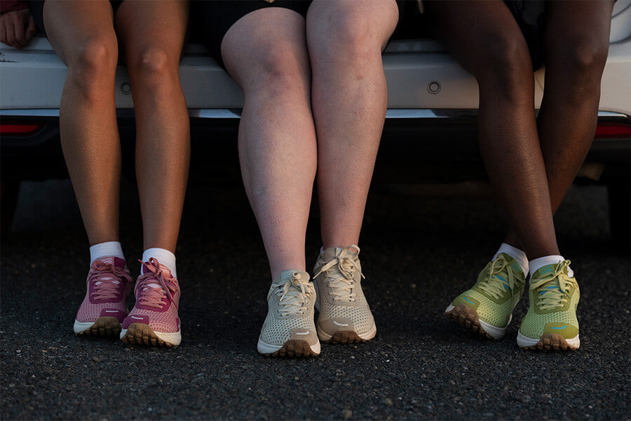 Three people sitting wearing Hilmas showing only from the knees to the ground