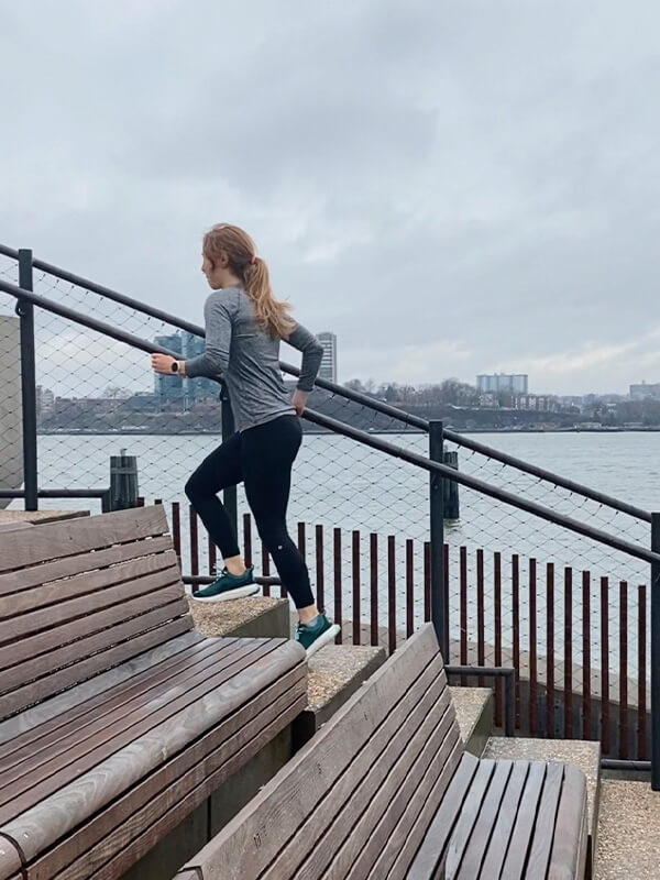 Woman working out running up steps in Hilma Running Shoes. Hilma Running Instagram Page.